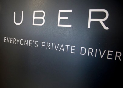 Uber Technologies Inc. signage stands inside the company's office prior to Senator Marco Rubio, a Republican from Florida, speaking in Washington, D.C., U.S., on Monday, March 24, 2014. Rubio addressed the need to adapt antiquated government regulations to increase economic opportunities for the 21st century and outdated regulations limit consumer choice. Photographer: Andrew Harrer/Bloomberg via Getty Images